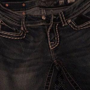 A pair of miss me jeans